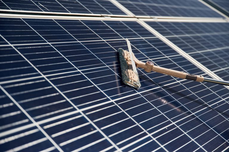 close up view of cleaning solar panels surface